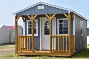 The Painted Cabin shown with wood siding for sale or rent to own in Natchez MS by Blaylock Portable Buildings